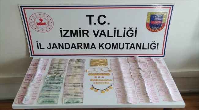İzmir'de FETÖ bahanesiyle dolandırıcılık yaptığı iddia edilen 2 kişi yakalandı